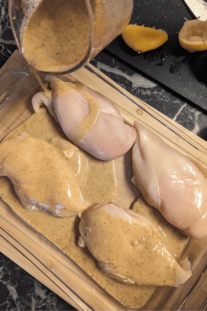 maple lemon chicken being basted