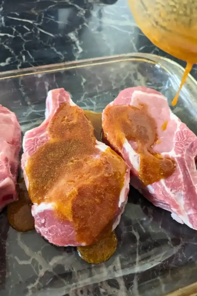 adding the asian marinade to pork loin