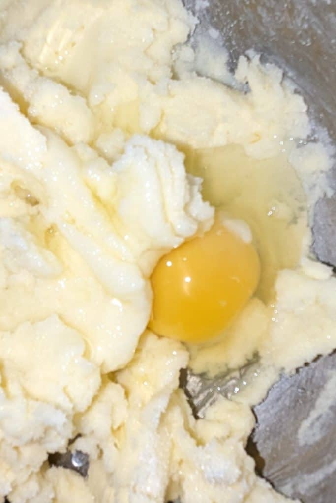 adding egg to butter sugar mix