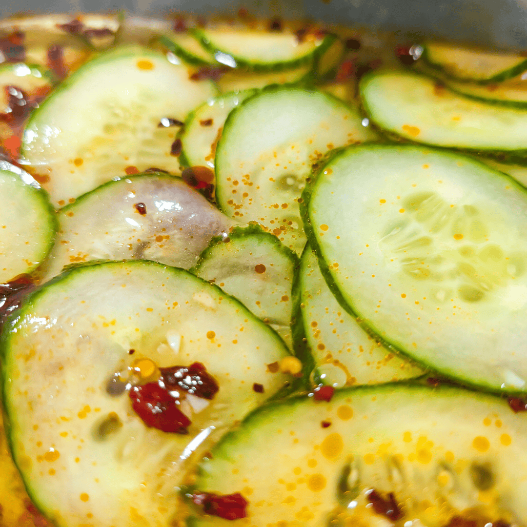 Fresh cucumber salad with spicy dressing, perfect for healthy summer recipes.