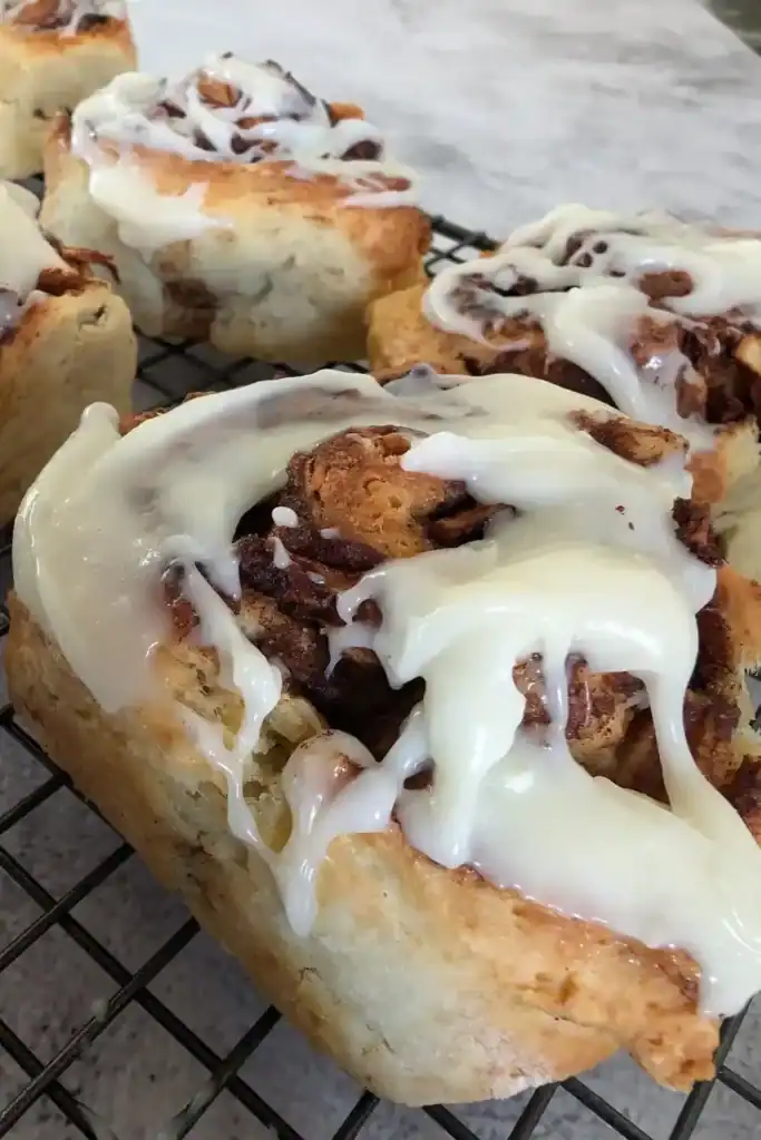 close up frosted apple cinnamon buttermilk sweet rolls