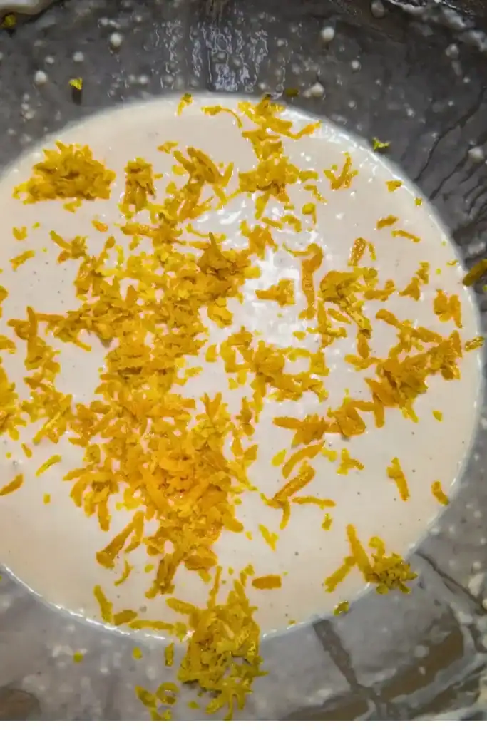 adding orange zest to pancake batter