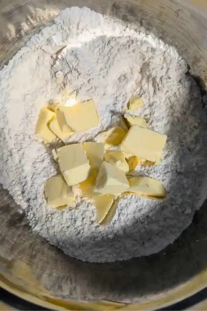 adding cold cubed butter to scone dry ingredients