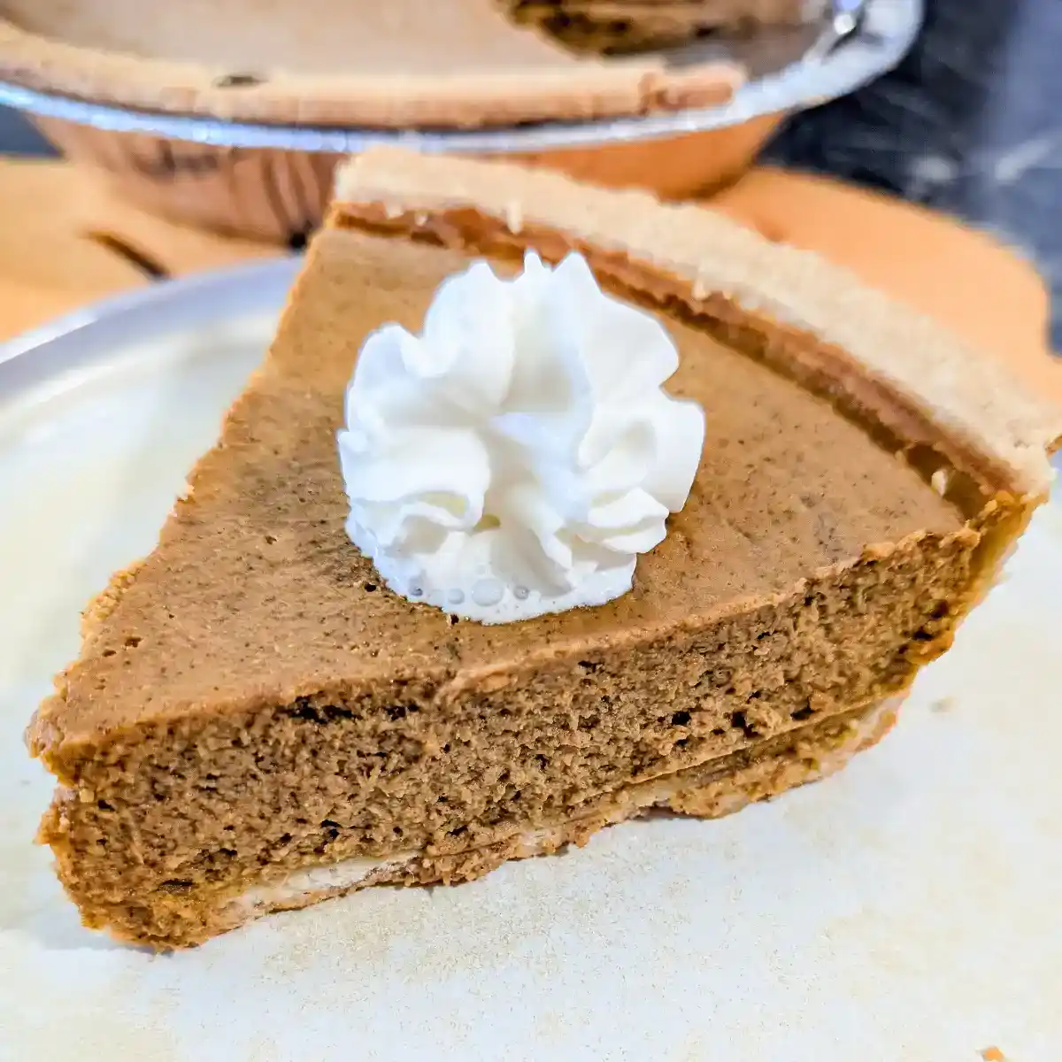slice of pumpkin pie on a plate