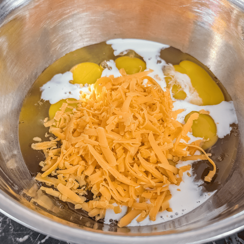Eggs, sausage, spinach, and cheese for a delicious breakfast dish.