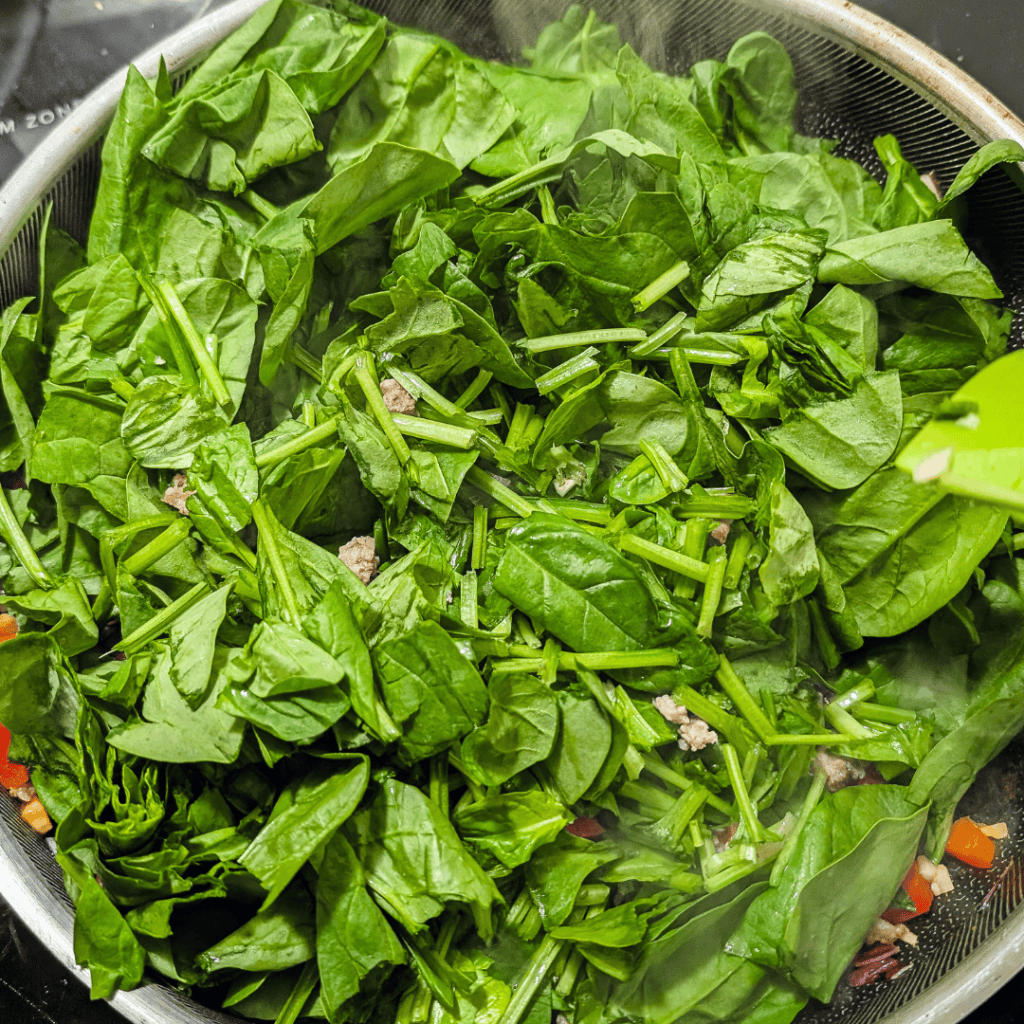 Fresh baby spinach leaves for cooking and recipes, healthy green vegetable.