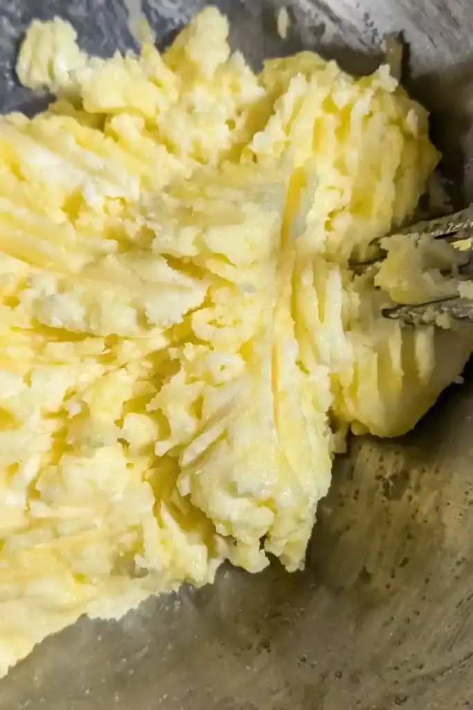 creamed butter and sugar in mixing bowl with egg yolk