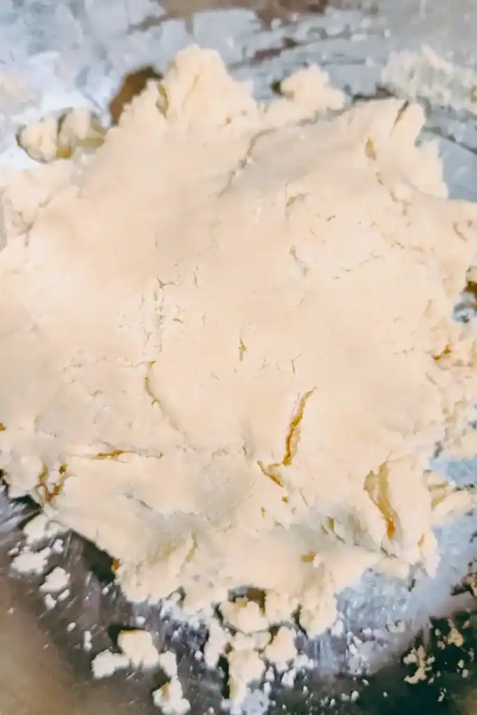 mixing cookie dough into a ball