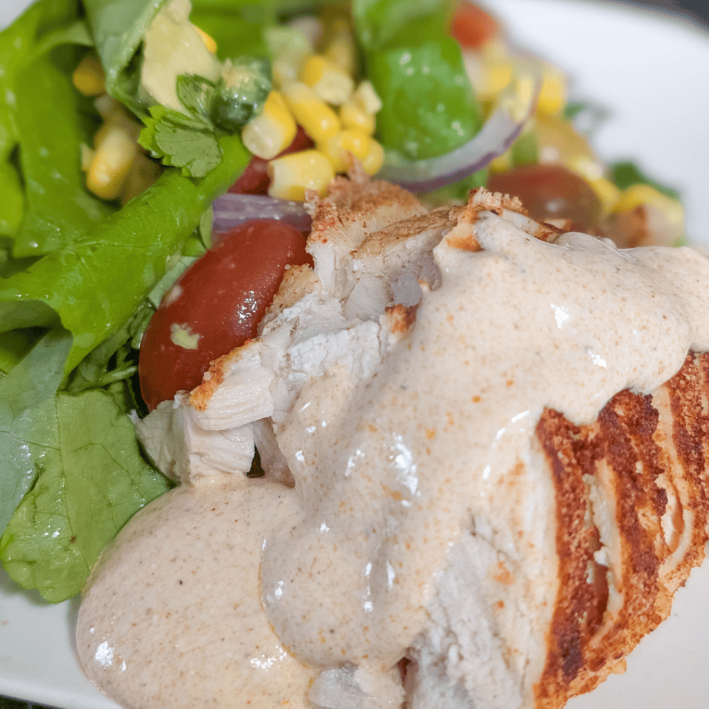 Delicious Chipotle Southwest Chicken Salad with fresh greens and creamy dressing.