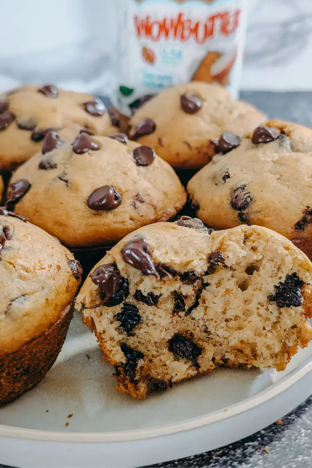 inside a muffin on a plate with others wowbutter blurred in background