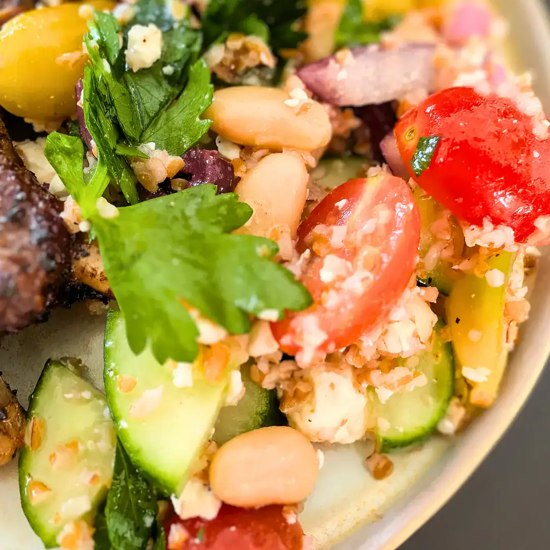 salad close up on edge of plate