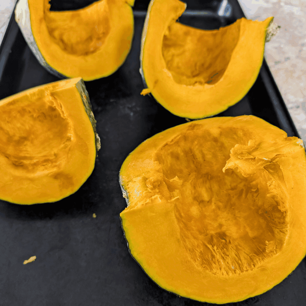 Fresh orange pumpkin slices ready to cook or bake. Perfect ingredient for seasonal fall recipes and hearty dishes.