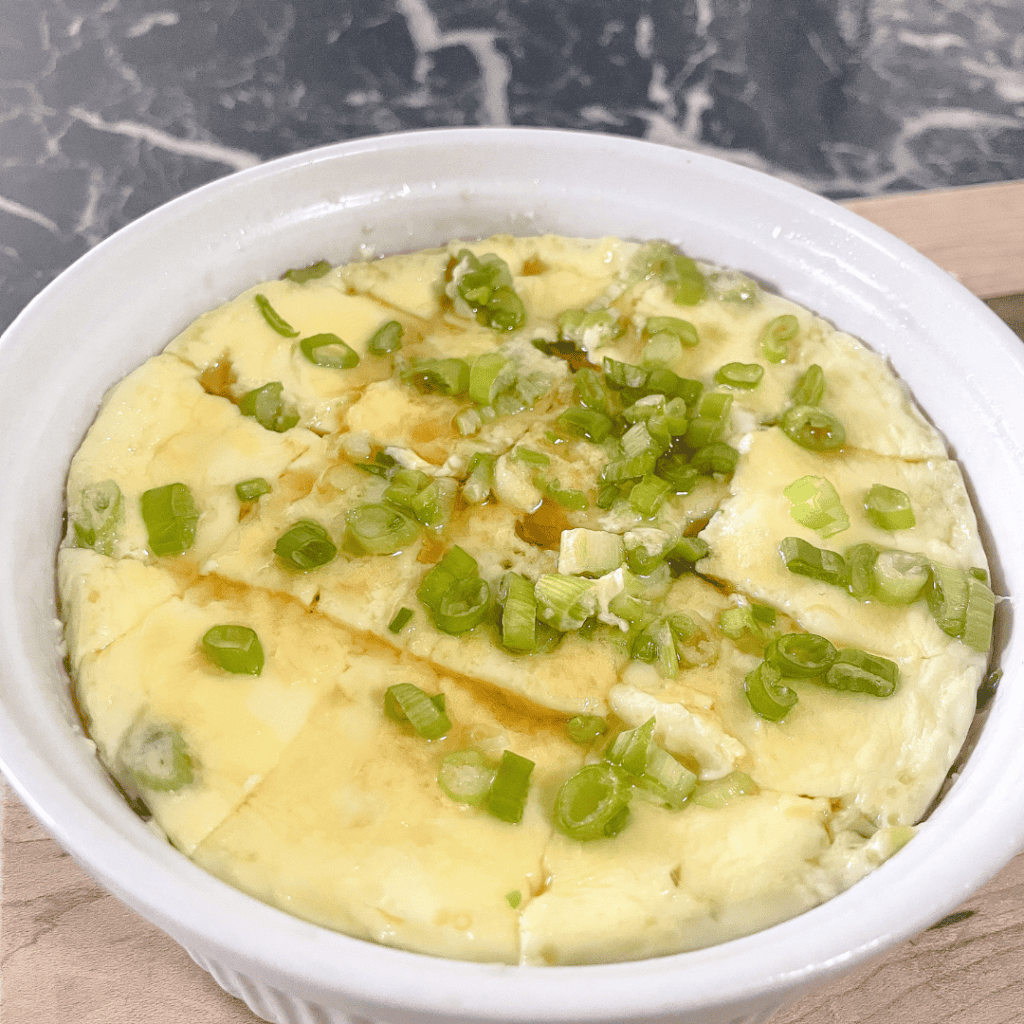 Delicious creamy mashed potatoes topped with chopped green onions, perfect for comfort food.