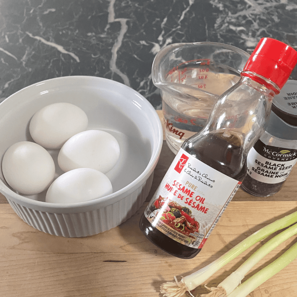 Eggs and sesame oil in a kitchen setting for cooking or baking.