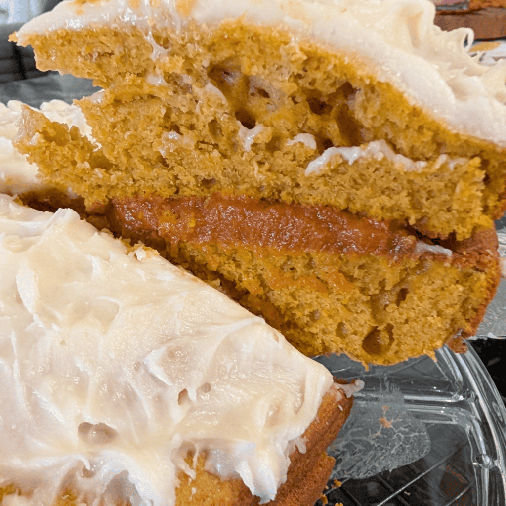 slicing the fall pumpkin layer cake